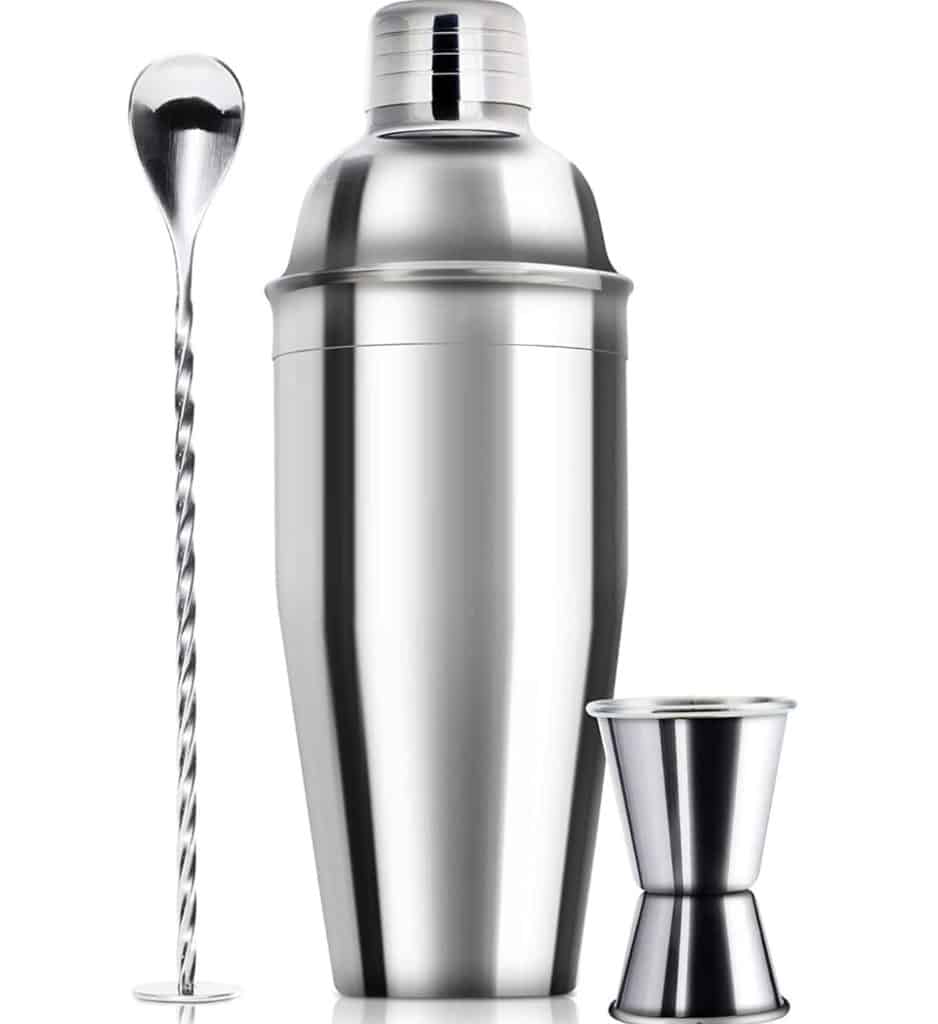 A sleek stainless steel cocktail shaker set, perfect for crafting a refreshing strawberry basil cocktail, includes a shaker, a twisted mixing spoon, and a dual-sided jigger, all set against a plain white background.